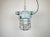 Industrial factory hanging light manufactured by Elektrosvit in former Czechoslovakia during the 1970s. It features a cast...