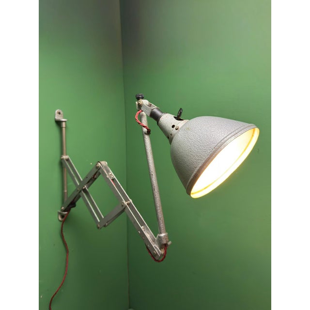 1930s industrial scissor lamp designed by renowned german designer curt fischer for midgard . these lamps were fixed to...
