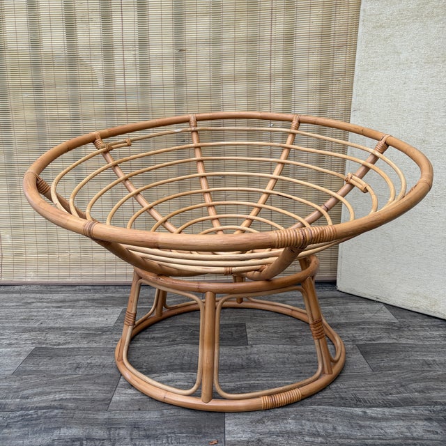 Vintage Coastal Style Bowl-shaped Papasan Rattan Lounge Chair. Circa 1980s Features a two pieces sculptural rattan and...