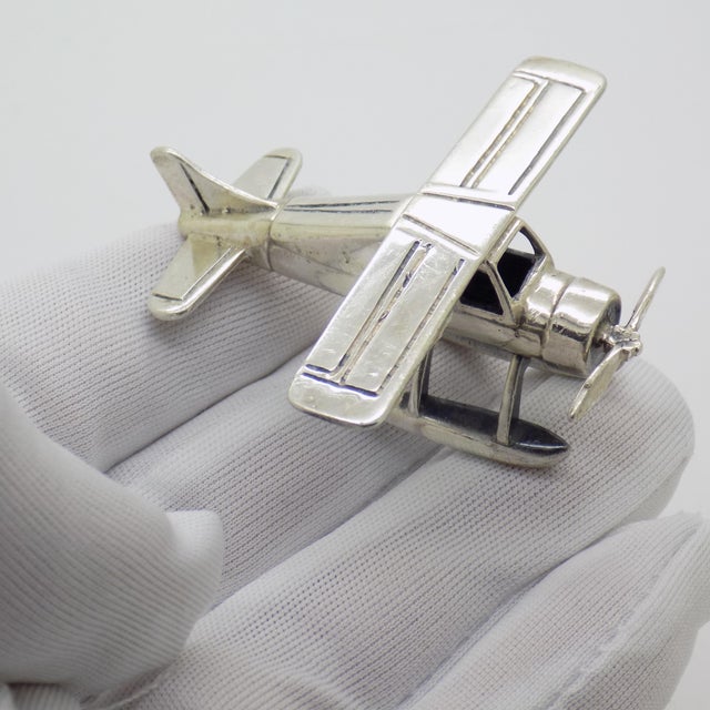 A captivating vintage floatplane seaplane figurine, handcrafted in Italy during the 1970s/1980s in genuine Sterling Silver...