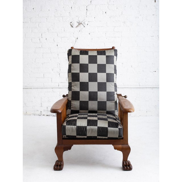 Victorian era Morris Chair with paw footed front legs and wheels at the back. Cushions are down-filled. The frame is...