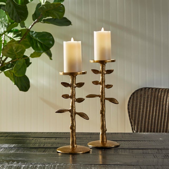 In a heavy cast aluminum, the Brier Candle Stands sprout up from the surface in a loose, sculpted style. A whimsical way...