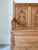 This lovely piece is a vintage English pine settle or storage bench, featuring carved daisy and leaf motifs. Crafted from...