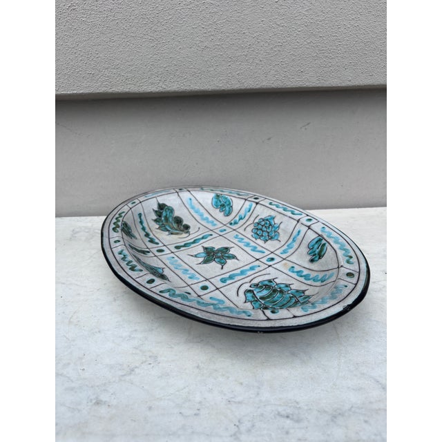Large Mid-Century Jerome Massier Vallauris platter , circa 1950. Decorated with green leaves and flowers on a white...