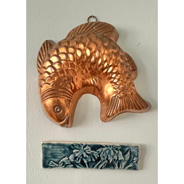 French Country hanging copper molds with tin lining. In the shape of a jumping fish. Please see condition details noted....
