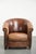 This beautiful English-style sheepskin club chair in gorgeous cognac tones features a fixed seat cushion, is finished with...