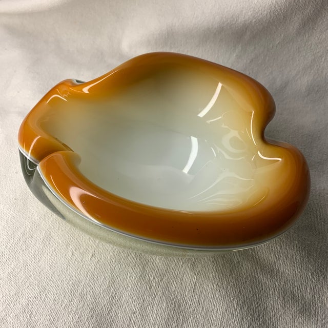 Bring a touch of mid-century Italian luxury into your home with this authentic, hand-blown Murano art glass clam shell...