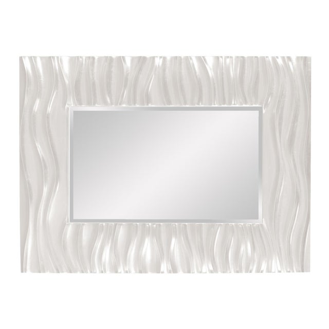 Our Zenith Mirror features a rectangular frame that is characterized by a deep textured wave design. The waves give an...