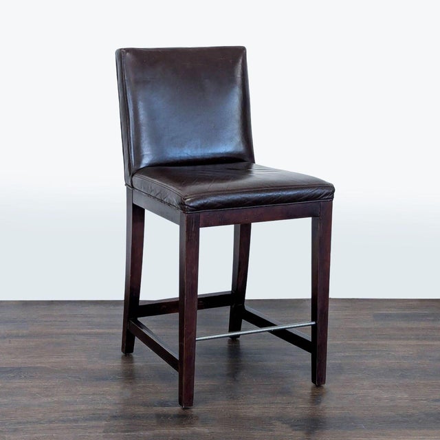 Hardwood frame with leather upholstery and steel footrest. Brand: Room & Board. Original Price: $899. Dimensions (in): 19W...