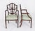 This is an absolutely fantastic antique pair of federal revival shield back arm chairs, circa 1920 in date. These chairs...