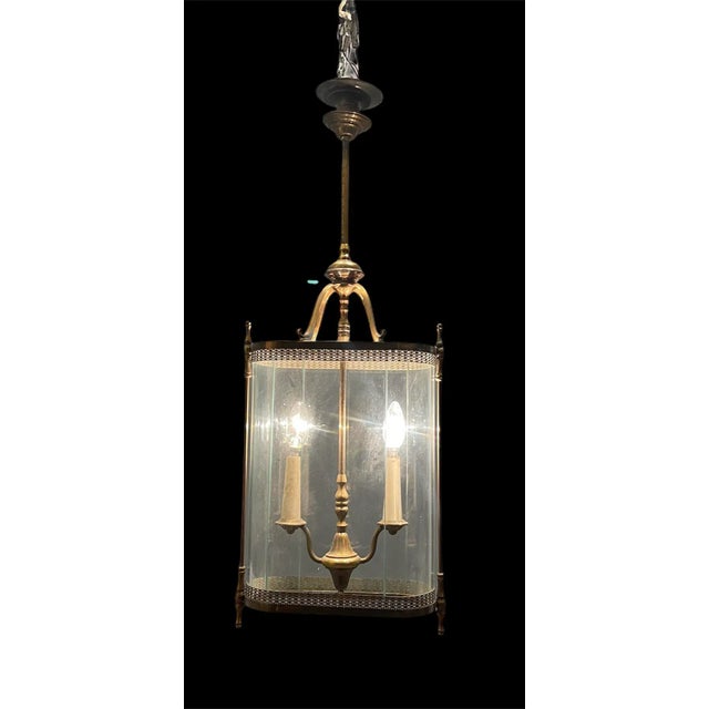 Large glass and bronze pendant light from the 1930’s. -Bronze frame with exquisite detailing -Glass Shades -Original...