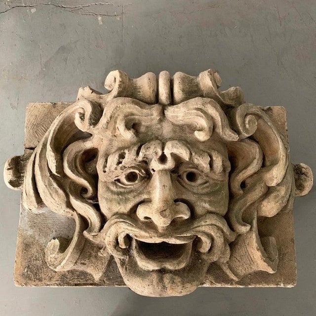 This large, carved concrete, alto relief sculpture depicts an open-mouthed, Poseidon-like, gargoyle. This outdoor statue...