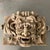 This large, carved concrete, alto relief sculpture depicts an open-mouthed, Poseidon-like, gargoyle. This outdoor statue...