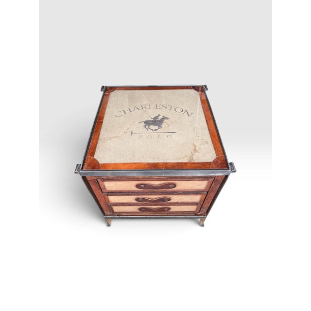 A distinctive late 20th-century campaign-style side table that blends equestrian-inspired design with modern luxury....
