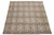 This flatweave natural jute rug showcases a contemporary Dhurrie design, featuring a tan-beige base color and stylish gray...