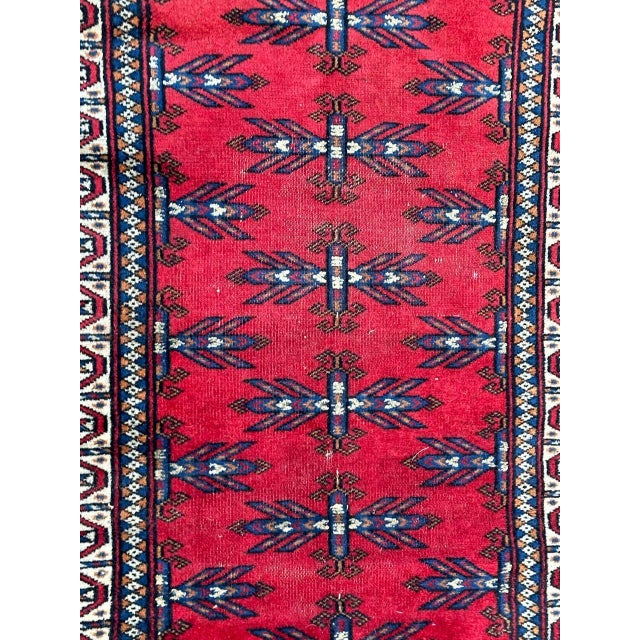 Pretty mid century Turkmen Baluch rug with nice tribal design and beautiful colours with a red field, entirely hand...