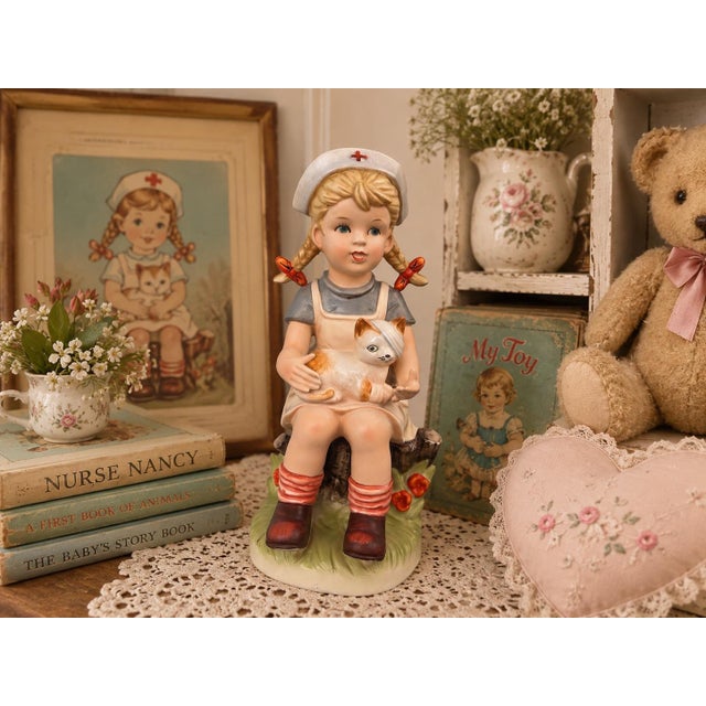 Charming vintage Napcoware porcelain figurine from the beloved “Our Children” collection, depicting “Nurse Nancy” seated...