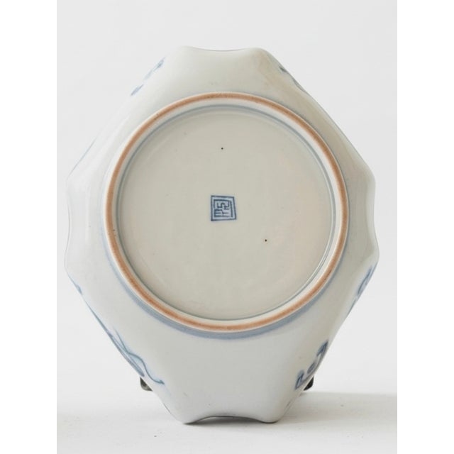 A Masterwork of the Golden Age of Porcelain This magnificent center bowl is a verified artifact of Japan’s Meiji Period...