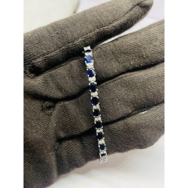 Gold Purity: 18K Solid Gold (stamped) DIAMOND: 0.45 CTS SAPPHIRE: 11.47 CTS 18K GOLD GROSS WEIGHT: 9.30 GRAMS NET WEIGHT:...