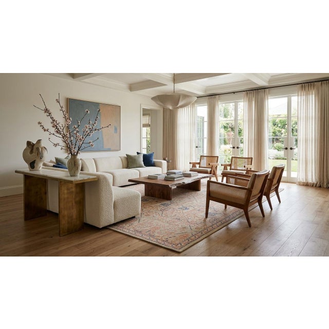 Elevate your space with this Apadana's modern Tabriz-style wool rug. Its distressed, transitional design blends...