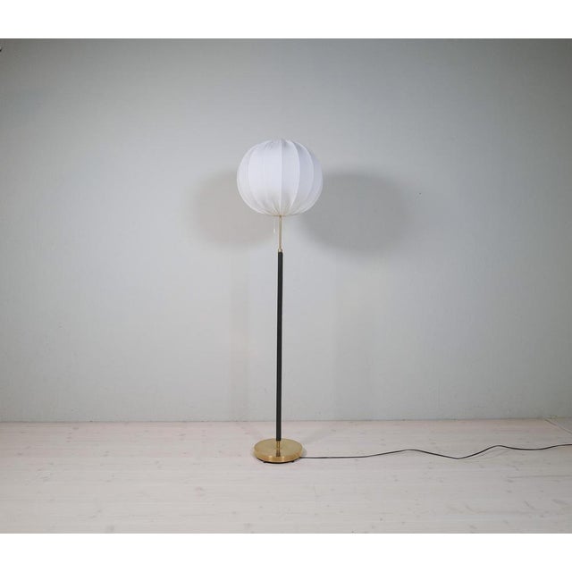 This lamp was made in sweden at falkenbergs belysning. Wonderful, assembled brass combination with leather rod. The brass...