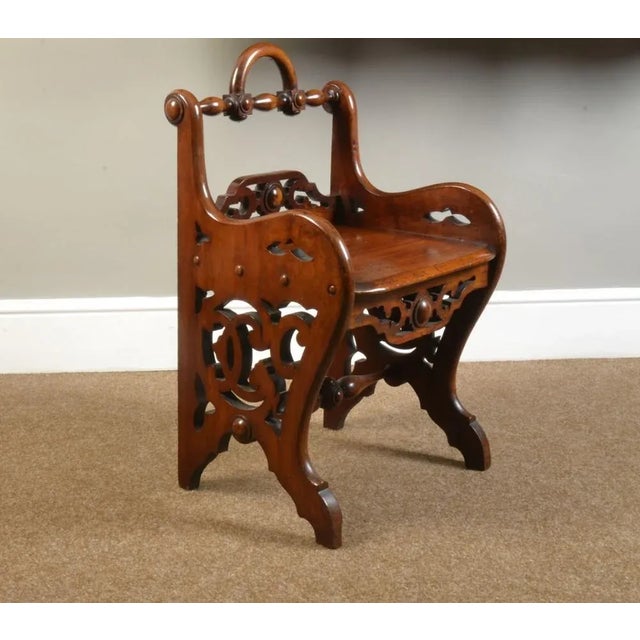 Pair of early Victorian Mahogany hall chairs in the manner of Richard Bridgens Each with an turned top rail above a...