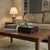 This exquisite vintage tabletop display stand features a framed natural landscape marble panel inset into a rich, dark...