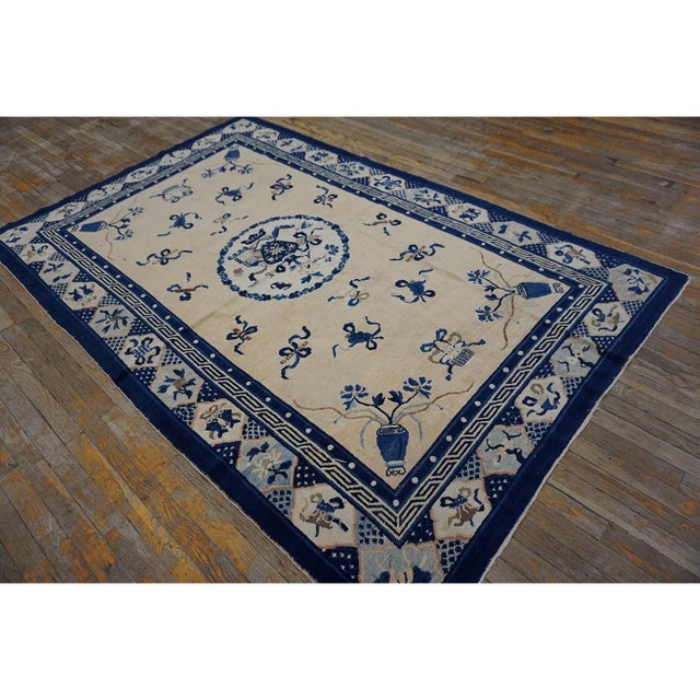Antique Peking Small Scatter Size Wool Coral Rug, Circa Date: 1890s. This late 19th-century Chinese textile exemplifies...