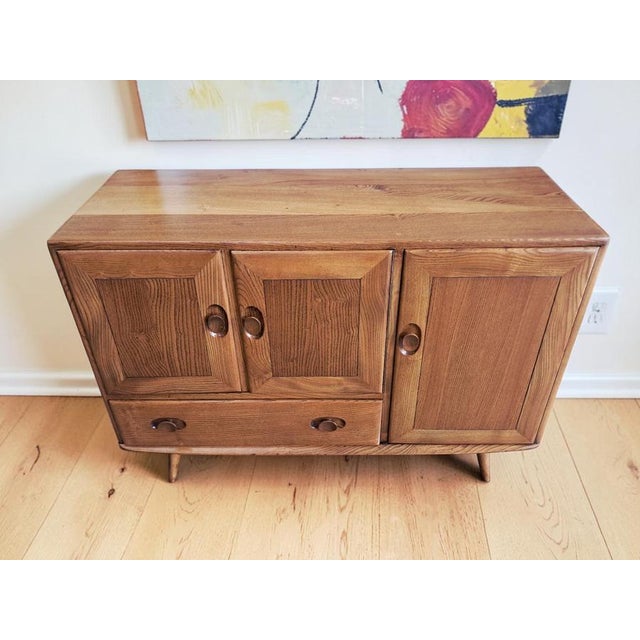 Stunning ercol model 467 small sideboard with elegant splayed legs, designed by lucian ercolani for ercol. Crafted in...