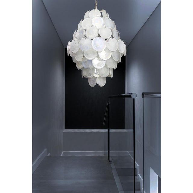 Vintage Italian Murano chandeliers in Vistosi style. Each chandelier has 87 fantastic white alabaster iridescent glasses...