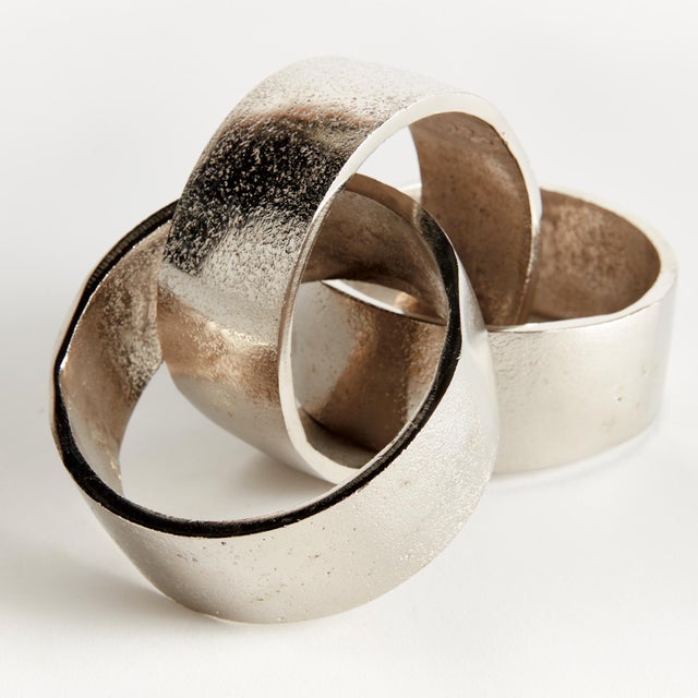 This cast aluminum objet is a modern take on the oversized chain link trend. Hand crafted using a centuries old sandcast...