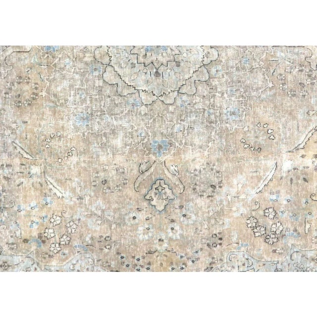 1960s Persian Kerman Rug. Hand woven in the Kerman region of Iran. Distressed and refinished in the U.S. The Persian...