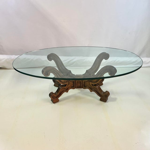 This is a gorgeous Mid-Century find. The Glass Oval top Coffee Table has a beautifully carved Walnut base. It features...