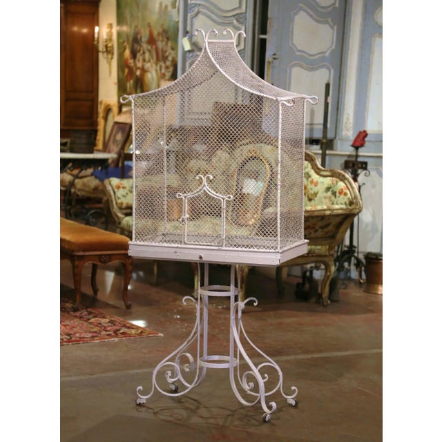 This antique French aviary brings sculptural presence and instant charm, standing over five feet tall with a striking...