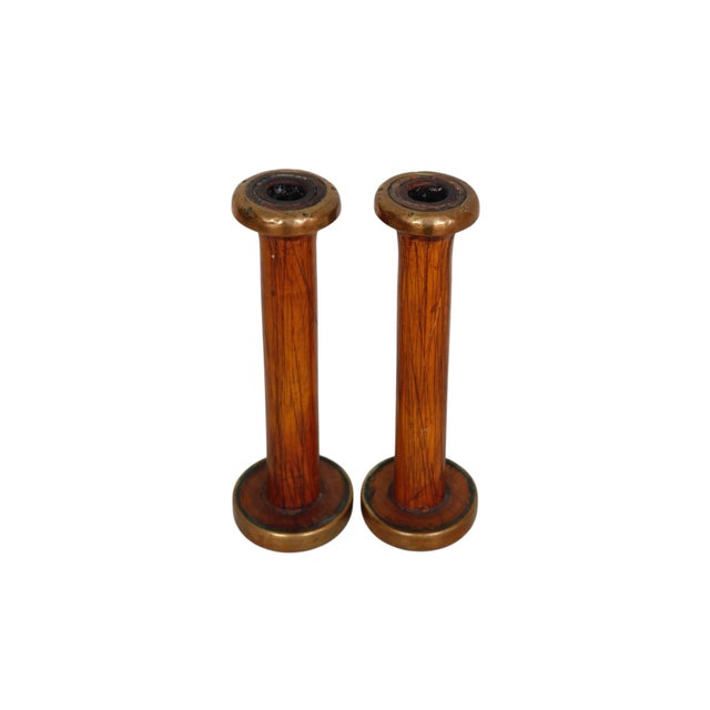 A pair of candlestick holders made from antique yarn spools. Wooden columns are finished with brass. Dimensions per candle...
