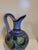 Thie is a beautiful Tolana folk art pitcher. It is handmade, handpainted and made in Mexico.