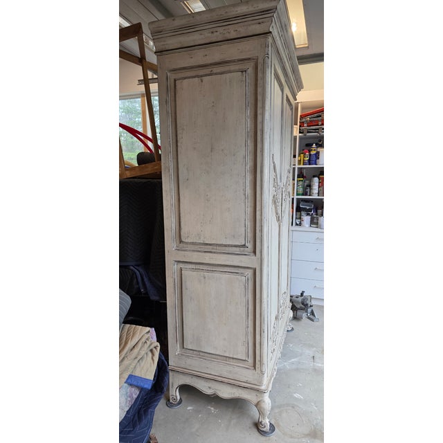 Large Armoire in french provincial style. Late 20th century manufacture. 3 shelves over 6 drawers. Decorative molding and...