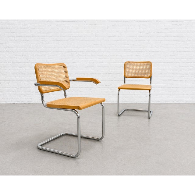 Marcel Breuer Cesca styled Mid Century Modern dining chairs, a Pair. The frames are constructed of tubular steel and the...