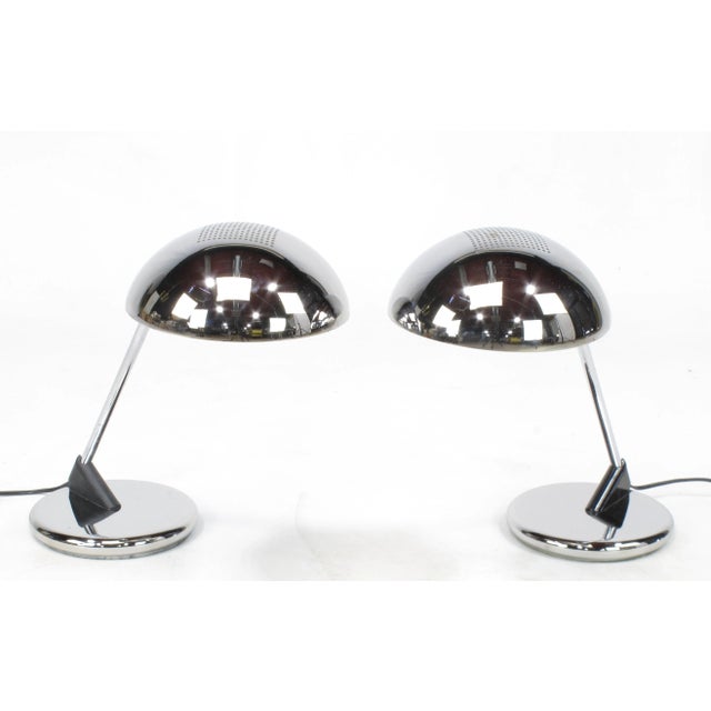 Uncommon pair of chromed steel desk lamps with cantilever dome shade and weighted base, circa 1960s, these are the only...
