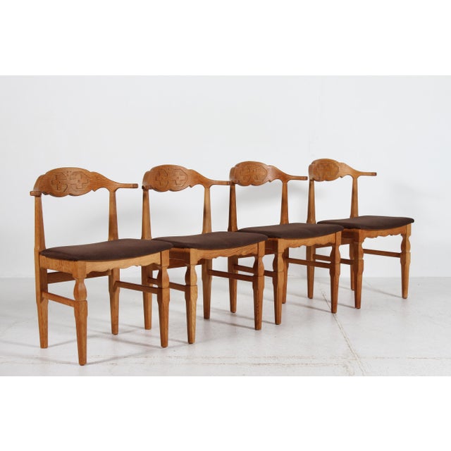 Here is a stunning set of 4 Danish vintage dinning room chairs in great country style designed by Henning Kjærnulf and...