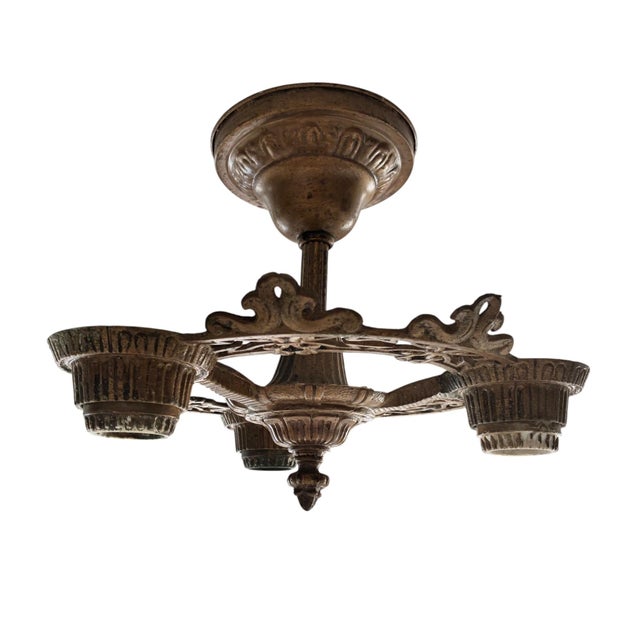 A vintage Art Deco ceiling light dating to the 1920s–30s. This cast metal flush-mount fixture features an openwork...