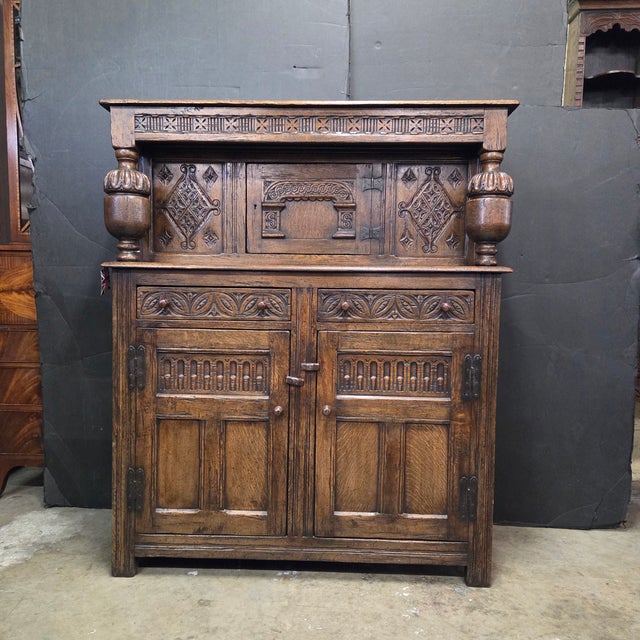 This 19th Century English Oak Carved Panel Jacobean 3 Door & 2 Drawer Court Cupboard With Bulbous Supports is a great...