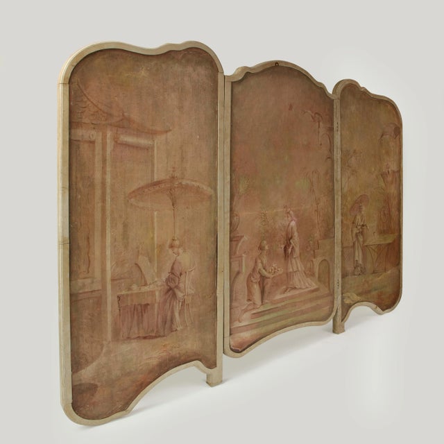 Comprising three shaped oil on canvas panels, with shirred ivory silk to the reverse, within a conforming greige-painted...