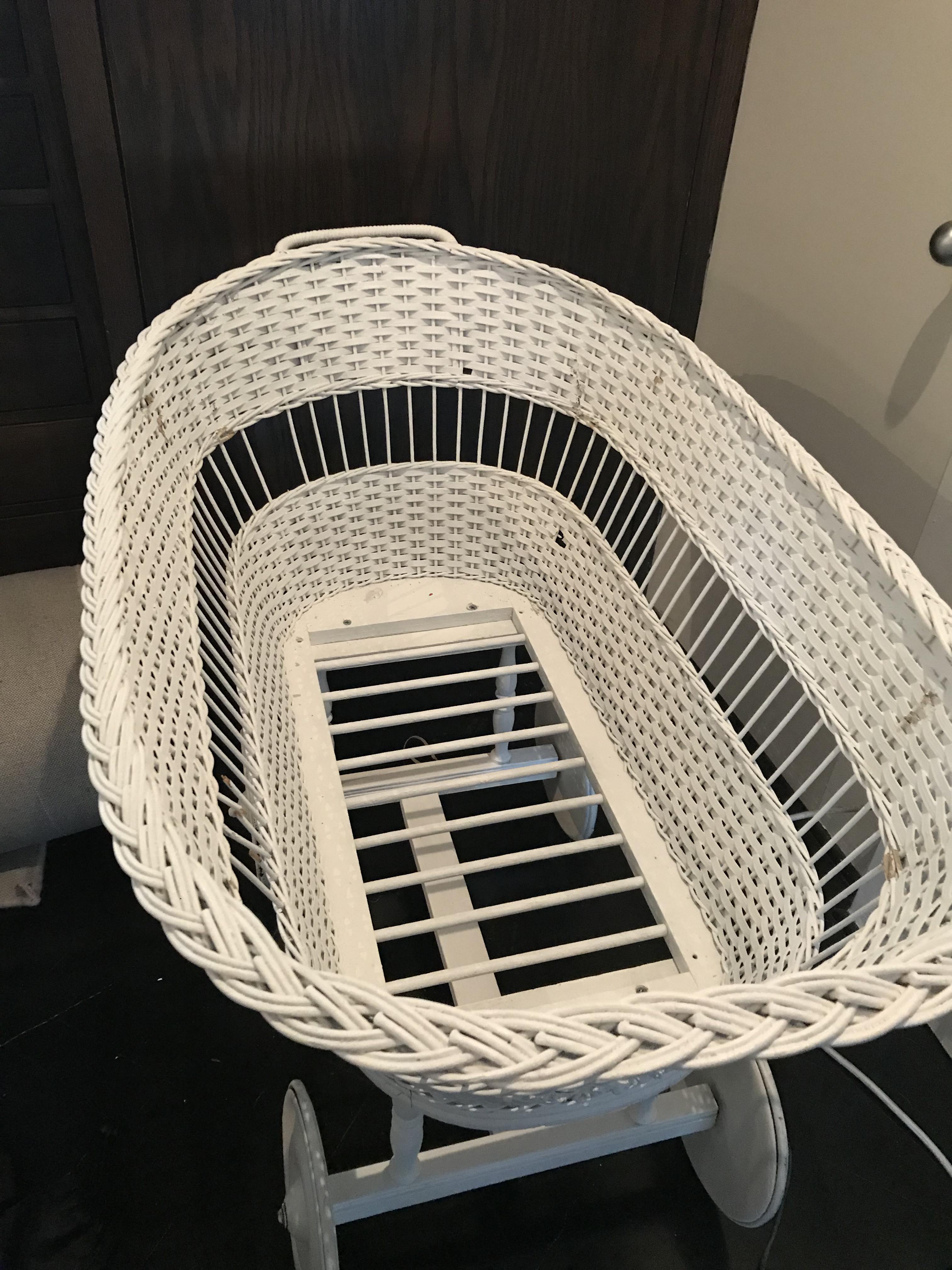 antique wicker baby bassinet on wheels