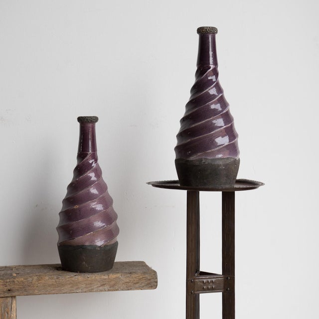 MID CENTURY POTTERY VASES A pair of intriguing pottery vases of unusual form, mallet shaped with twisted spiral design on...