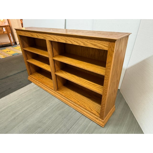 Design Plus Gallery presents a Double Wide Golden Oak Wood Bookcase. The shelving has modular interior shelves that are...