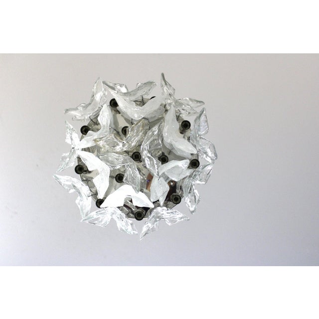 Massive chandelier of the “Catena” model by Kalmar. Manufacturer’s label present. The backplate is made of chrome-plated...