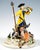Excellent meissen figurine group from the 19th century: a hunter in rococo attire - a yellow frock coat with a blue lapel...