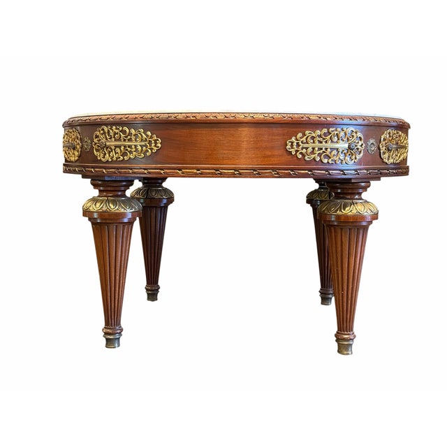 Elevate your living space with this elegant French-style round coffee table, featuring a luxurious marble top and timeless...
