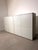 Elegant and timeless Lema sideboard finished in a sleek matte white lacquer. Its minimalist Italian design, clean lines...